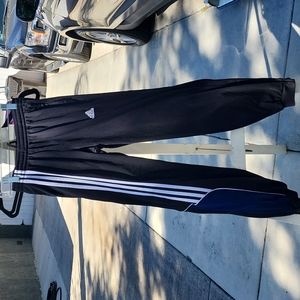 Adidas warm up pants with blue insert on the leg